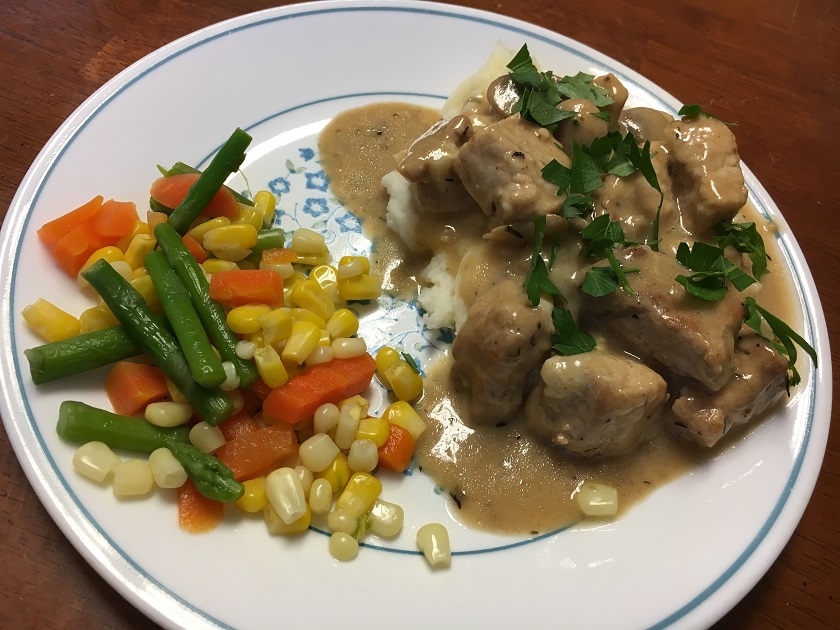 Pork with Mushrooms and Brie Sauce over Mashed Potatoes